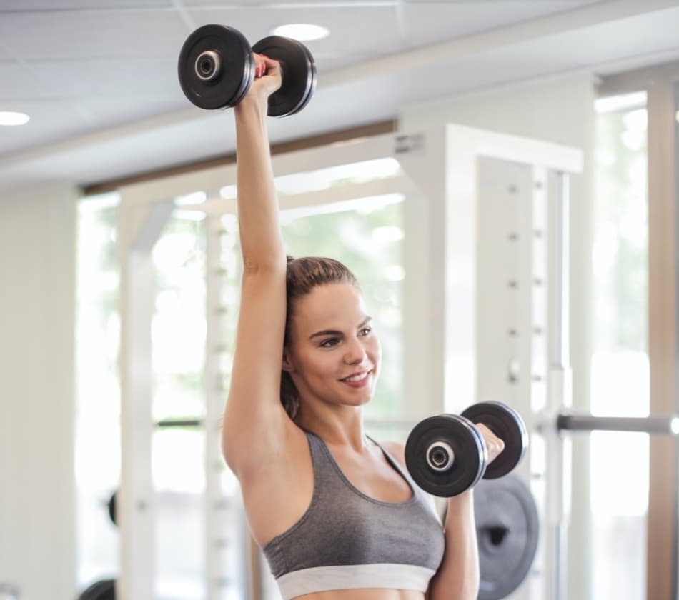 Single arm overhead press done with dumbbell