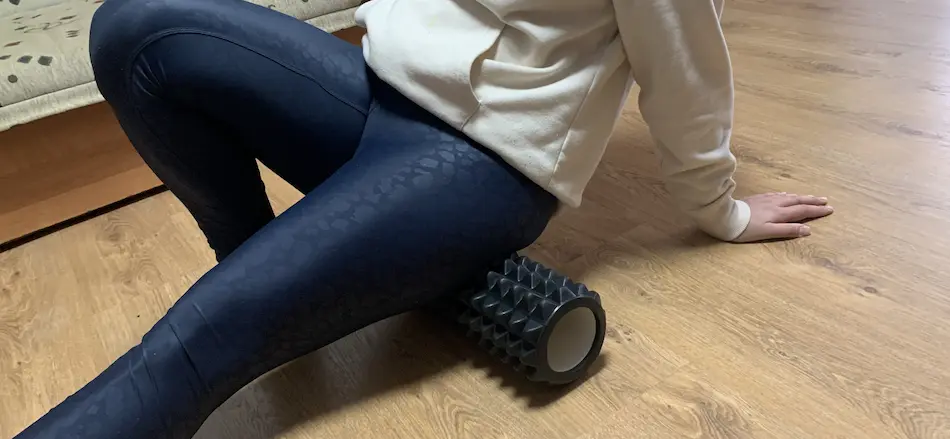 my wife foam rolling her glutes