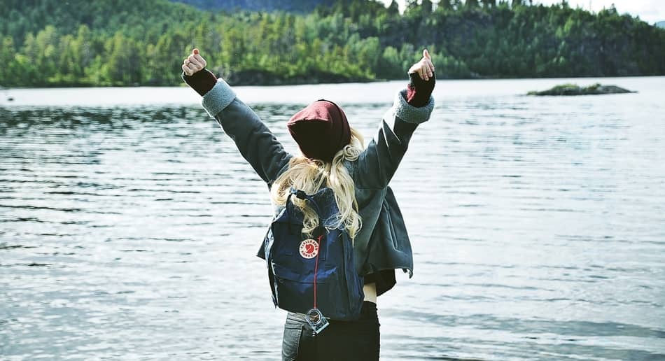 photo of woman lifting hands