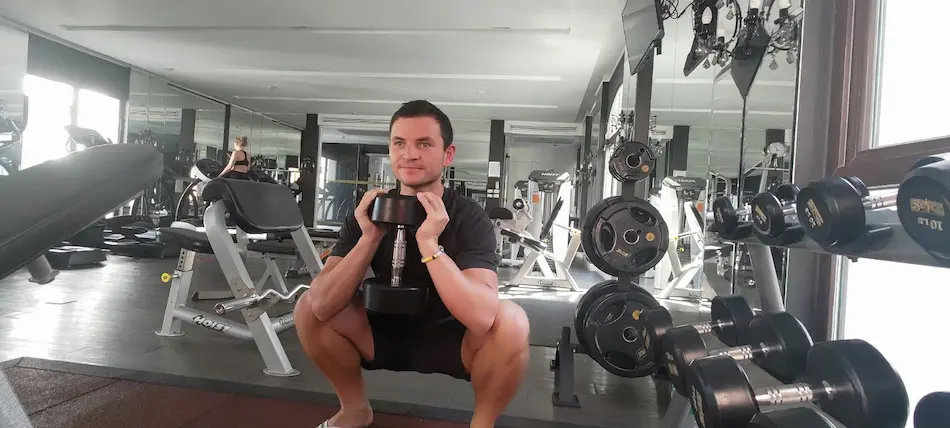 photo of me doing squats in the normal gym